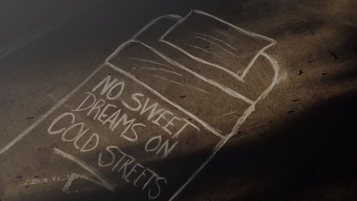 Chalk bed drawing with message about homelessness.