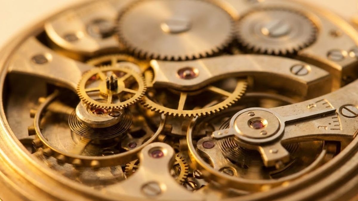 A detailed, warm-lit image of a clock mechanism, representing the body's internal circadian rhythm that sleep hygiene aims to regulate.