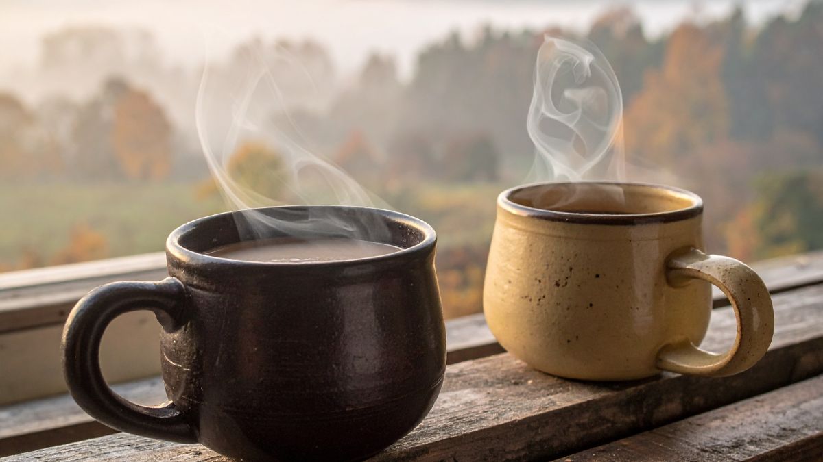 Two coffee mugs on a table representing men's conversation and connection.