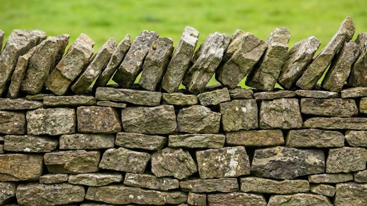 A dry stone wall representing how individual men come together to form a strong support structure.