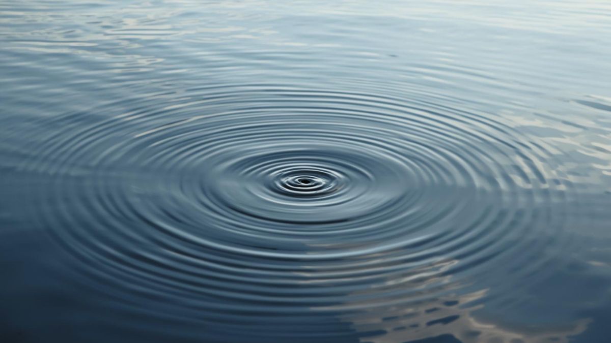 Ripples in water representing the wider impact of domestic abuse on work and mental health.