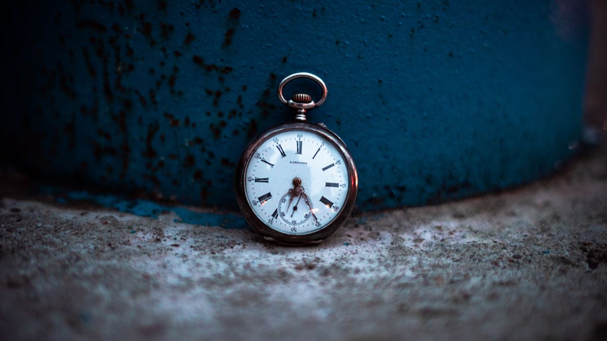 A watch and water on a nightstand, representing insomnia and fatigue associated with depression.