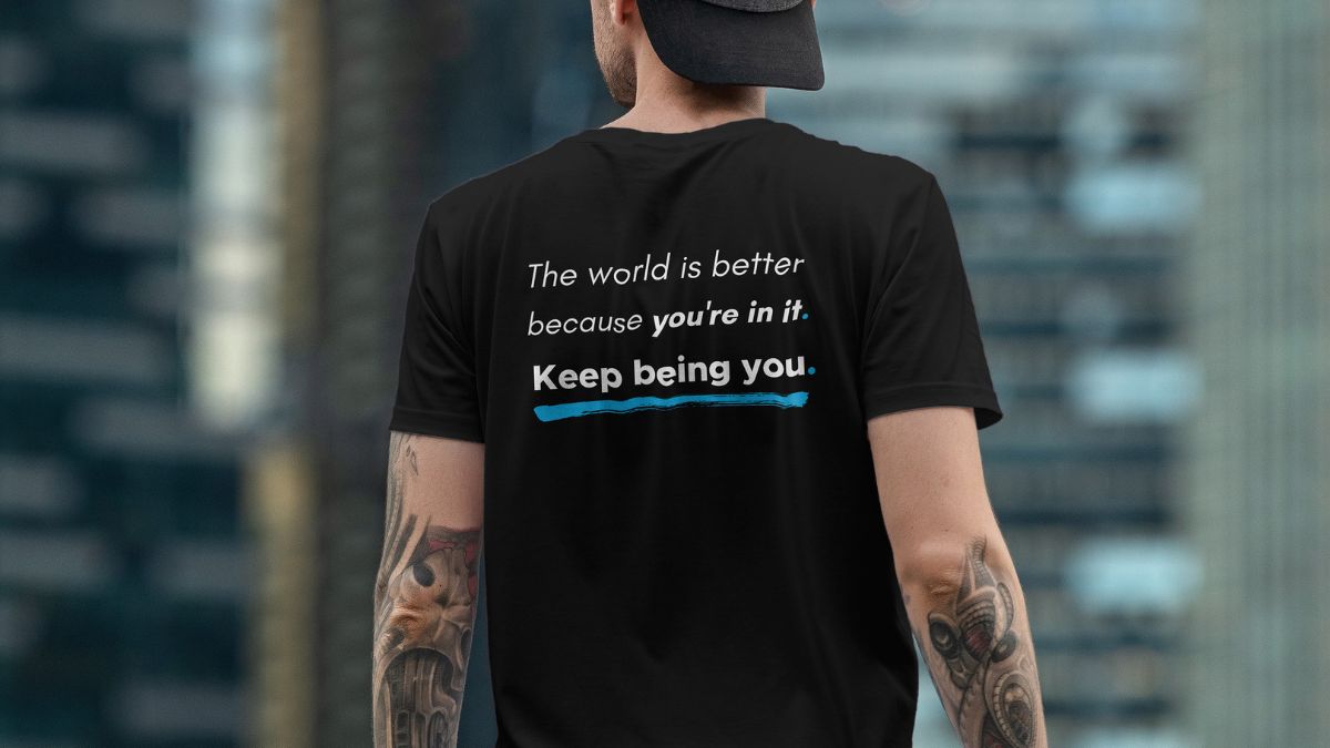 mmh the world is better because your in it The rear veiw of a man wearing an MMH Statement Apparel Tshirt with "The world is a better place because your in it. Keep going."