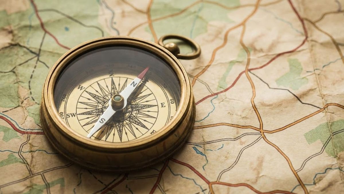A compass on a map representing finding the right route to mental health support.