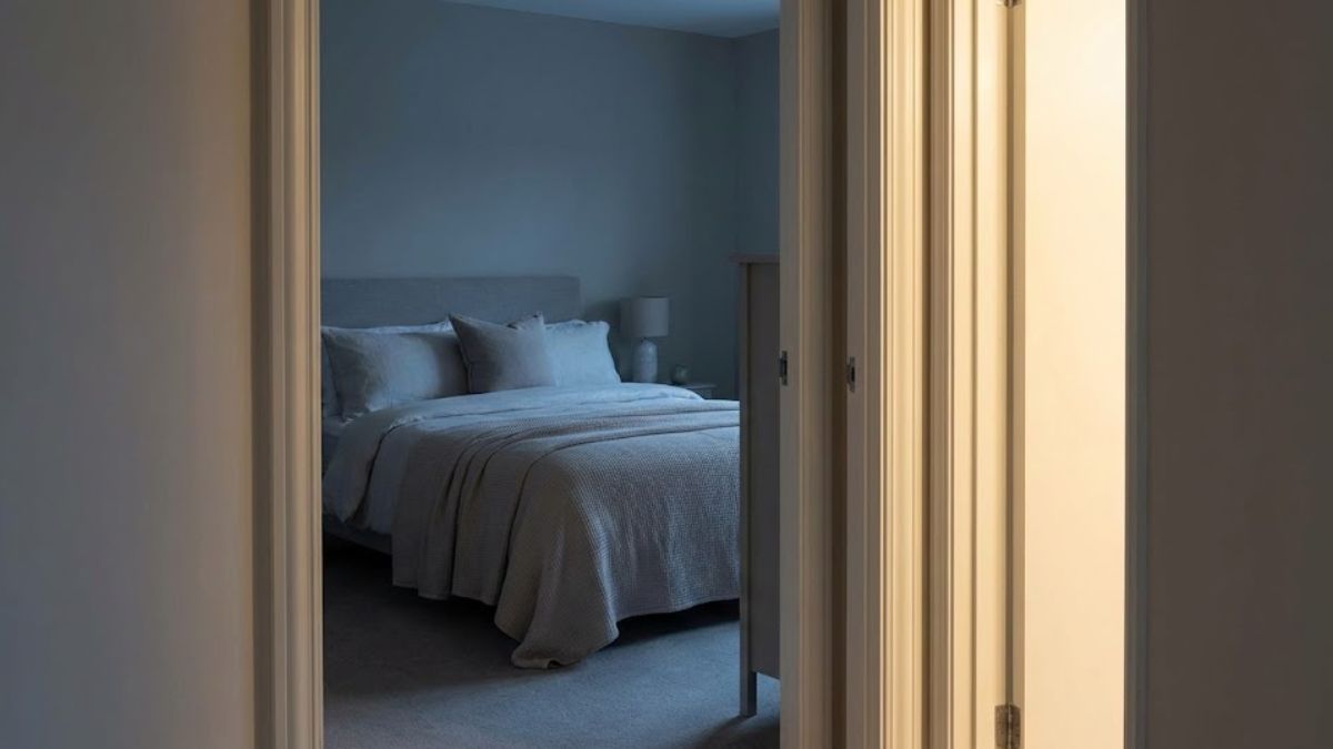 A final, inviting image of an open door leading to a calm bedroom, symbolizing that better sleep is accessible through simple changes.