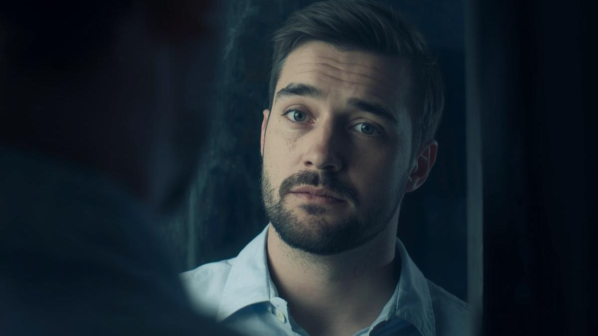A man looking into a foggy mirror, representing the confusion caused by narcissistic abuse.